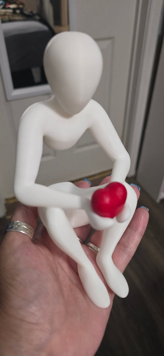 3D Figuring Holding a Red Heart