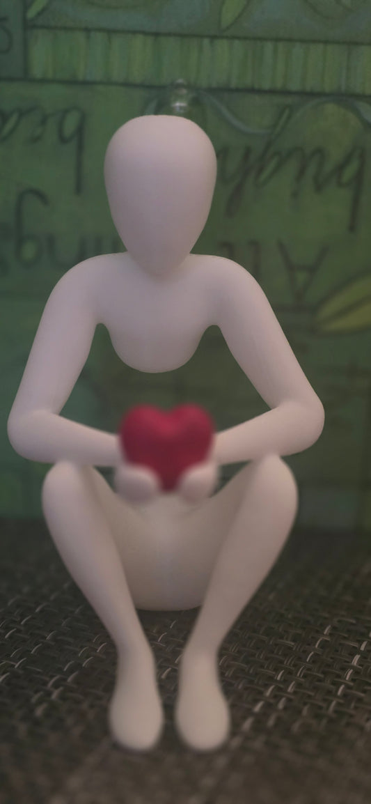 3D Figuring Holding a Red Heart